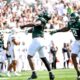 Michigan State football DE Ken Talley celebrates a sack.