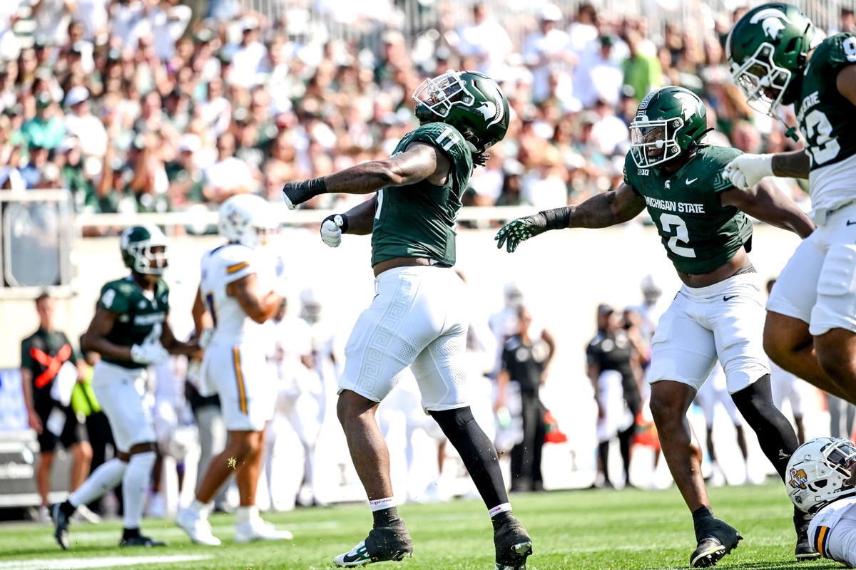 Michigan State football DE Ken Talley celebrates a sack.