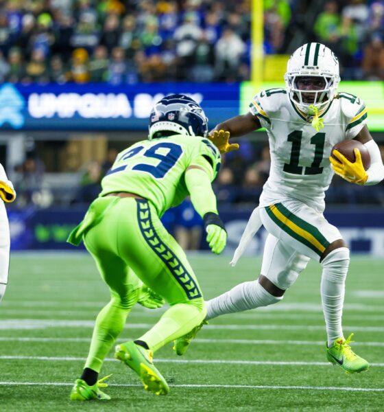 Former Michigan State football star Jayden Reed with runs the ball for the Packers against Seattle.