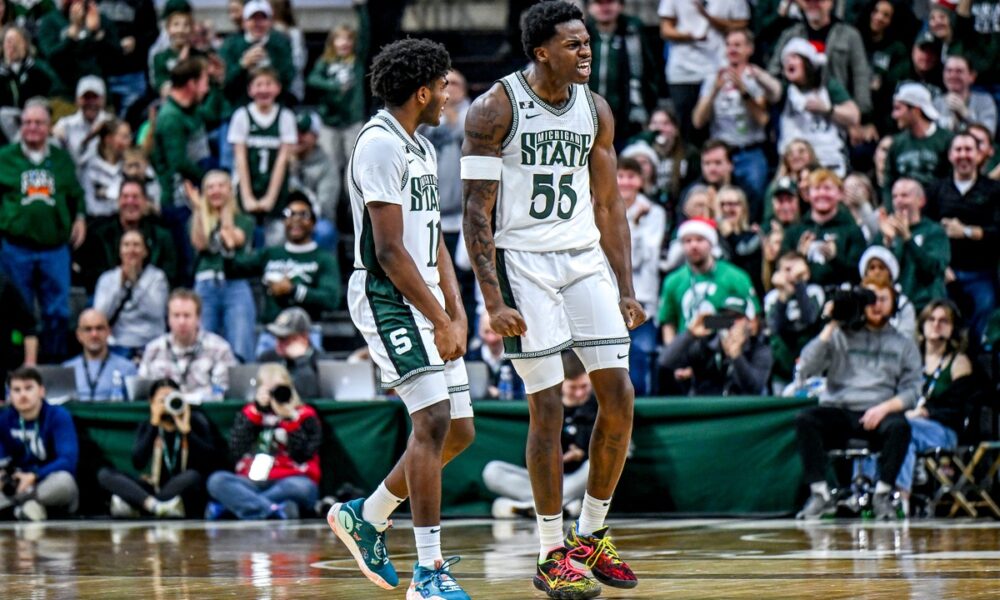 Jase Richardson celebrates with Coen Carr.