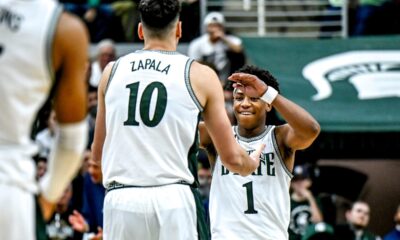 Michigan State basketball guard Jeremy Fears high-fives Szymon Zapala.