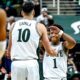 Michigan State basketball guard Jeremy Fears high-fives Szymon Zapala.