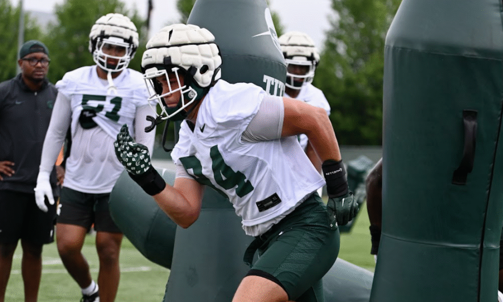 Michigan State football DL Cal Thrush goes through drills.