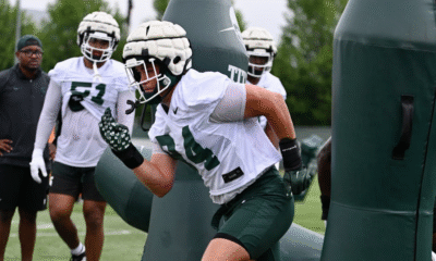 Michigan State football DL Cal Thrush goes through drills.