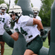 Michigan State football DL Cal Thrush goes through drills.