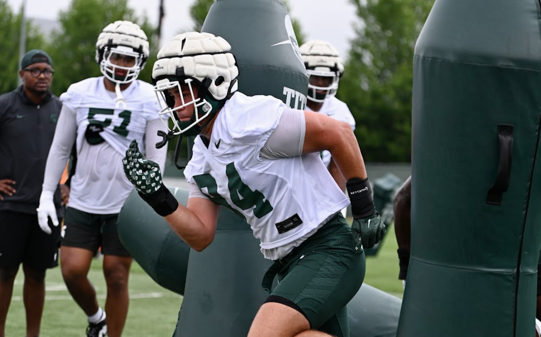 Michigan State football DL Cal Thrush goes through drills.