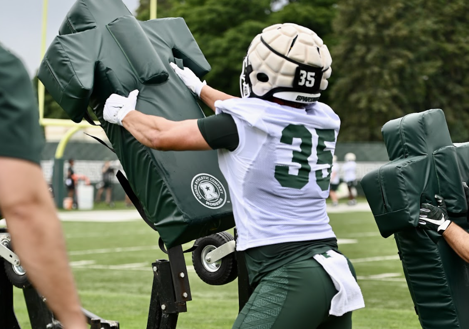 Michigan State football captain Sam Edwards goes through fall drills.