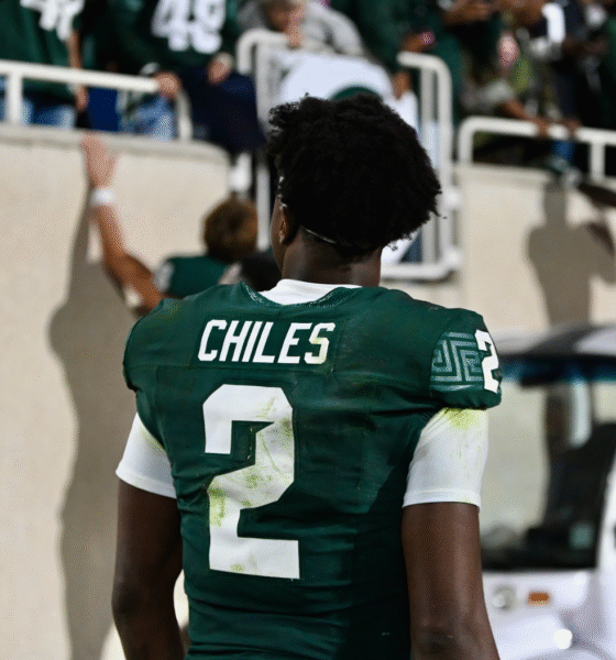 Michigan State football QB1 Aidan Chiles walks off the field.