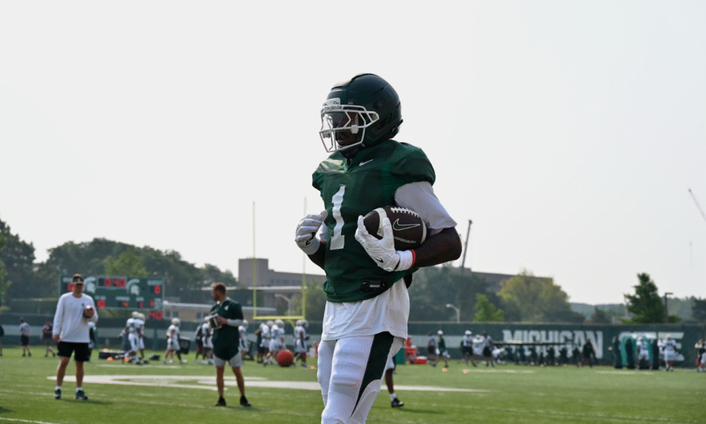 Omari Kelly catches a pass for Michigan State football