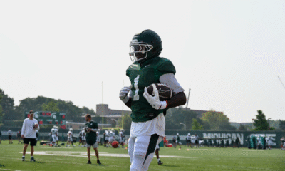 Omari Kelly catches a pass for Michigan State football