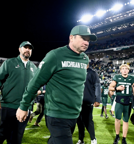 Michigan State football coach Jonathan Smith walks off the field after losing to Michigan