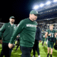 Michigan State football coach Jonathan Smith walks off the field after losing to Michigan